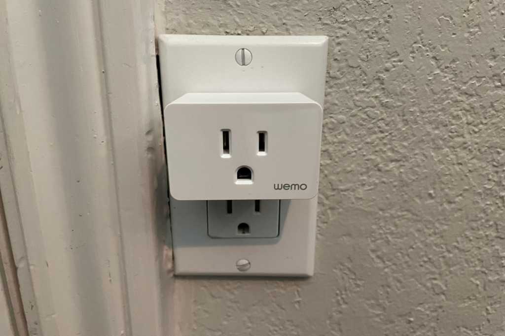 Wemo Smart Plug with Thread plugged into wall outlet