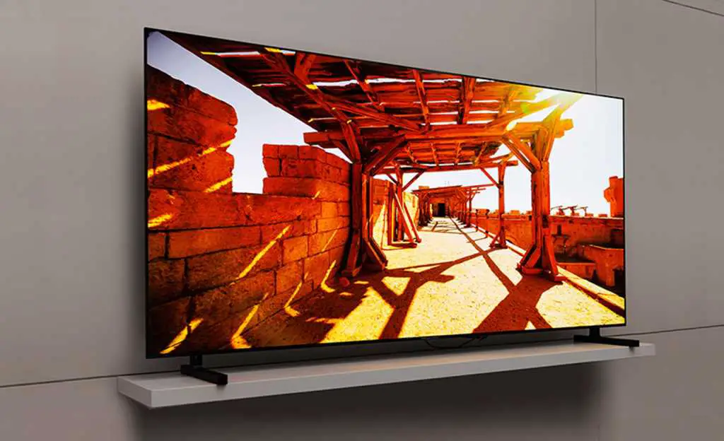 A Samsung QD-OLED TV showing an old castle ruin
